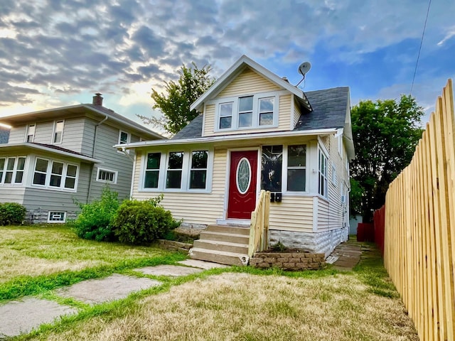 bungalow with a front yard