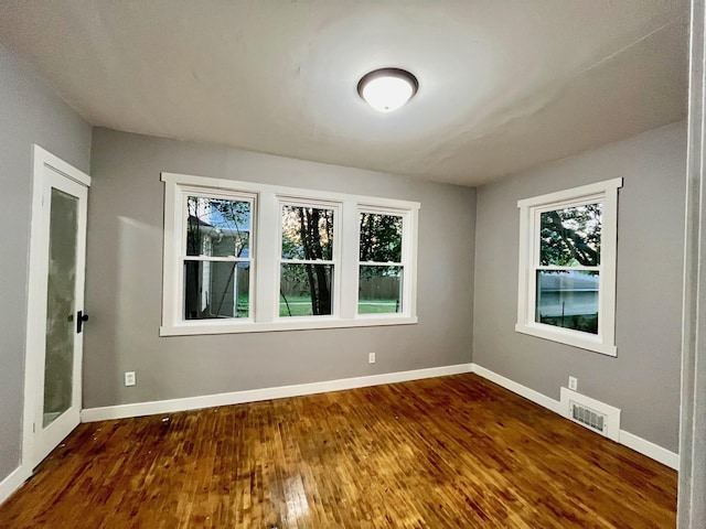 empty room featuring dark hardwood / wood-style floors