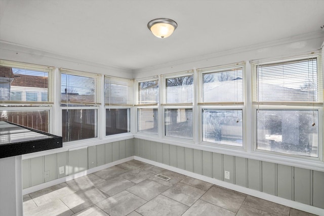 unfurnished sunroom with a healthy amount of sunlight