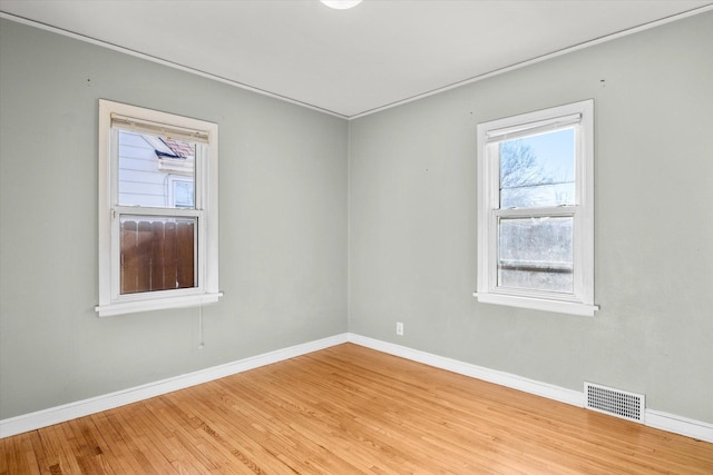 spare room featuring light wood-type flooring