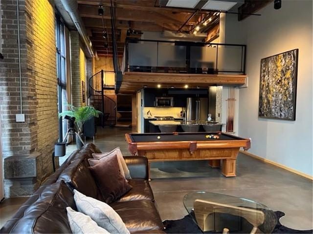 playroom with pool table and concrete flooring