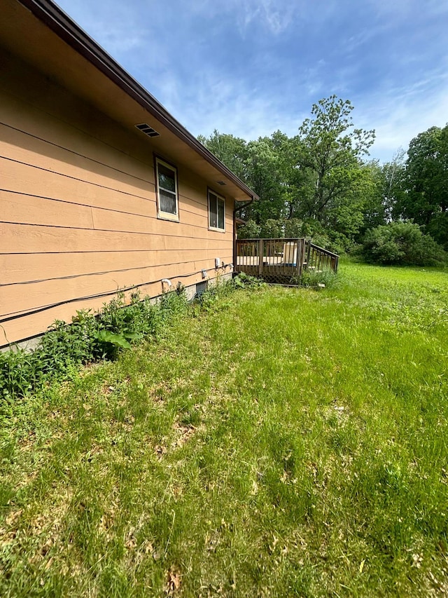 view of yard with a deck