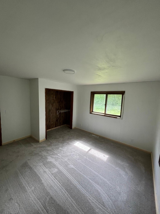 unfurnished bedroom featuring carpet flooring