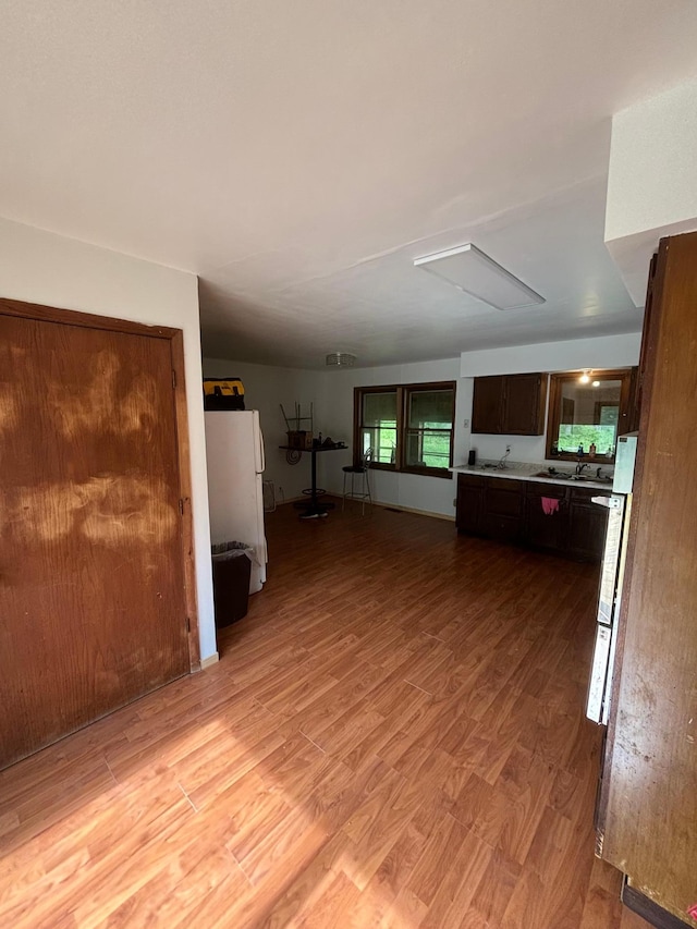 unfurnished living room featuring light hardwood / wood-style flooring