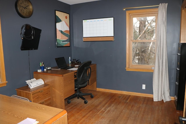 office space with dark wood-type flooring