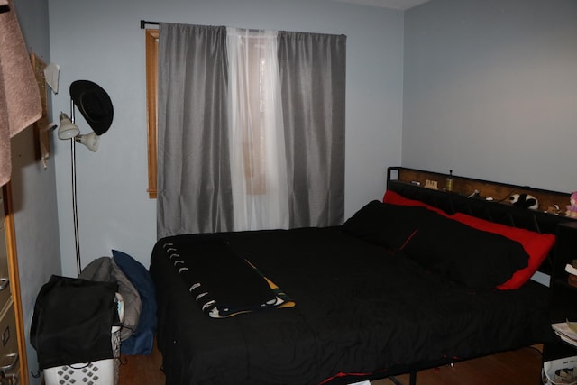 bedroom featuring hardwood / wood-style flooring