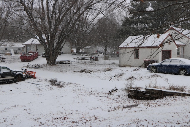 view of yard layered in snow