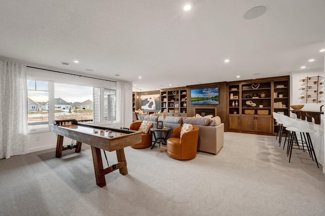 game room with carpet flooring and built in shelves