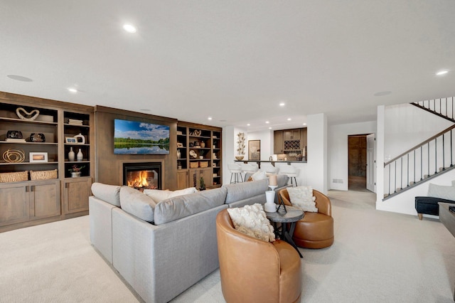 carpeted living room with built in shelves