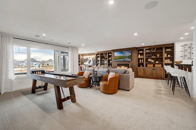 playroom with light colored carpet and built in features