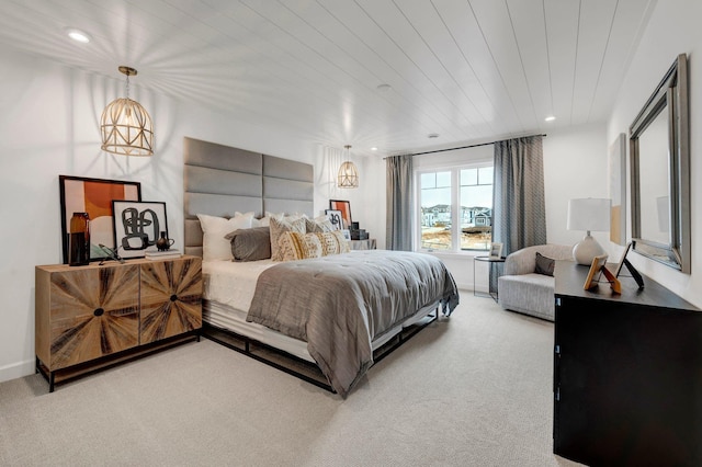 carpeted bedroom with wood ceiling