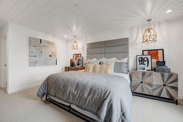 bedroom with carpet flooring and wooden ceiling