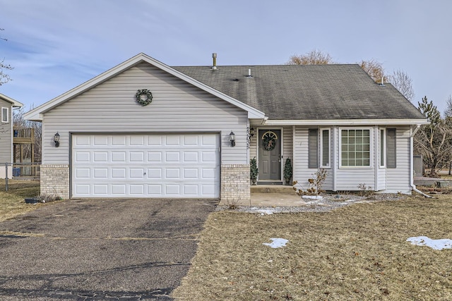 single story home featuring a garage