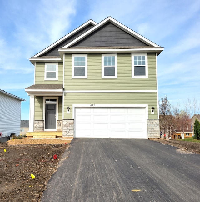 view of front of property featuring a garage