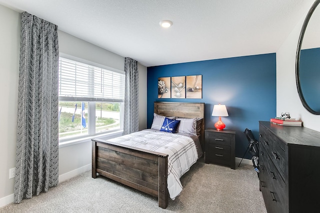 bedroom with light colored carpet