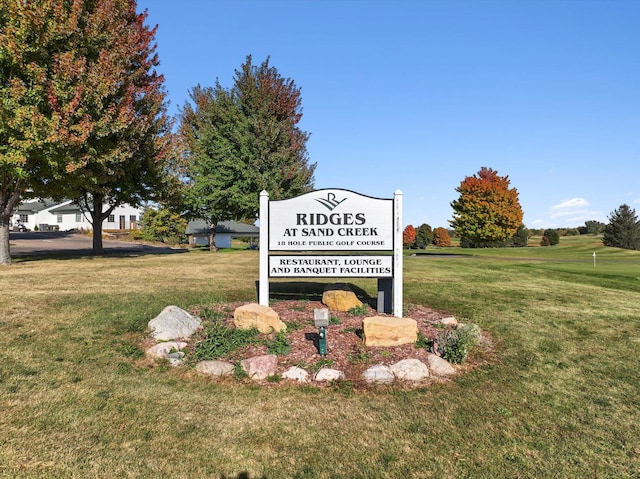 view of home's community featuring a lawn