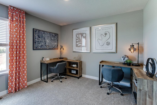 home office featuring baseboards, a textured ceiling, and carpet