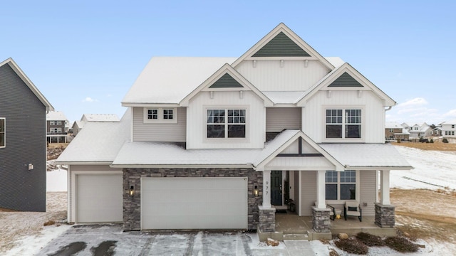 view of front of home with covered porch and a garage