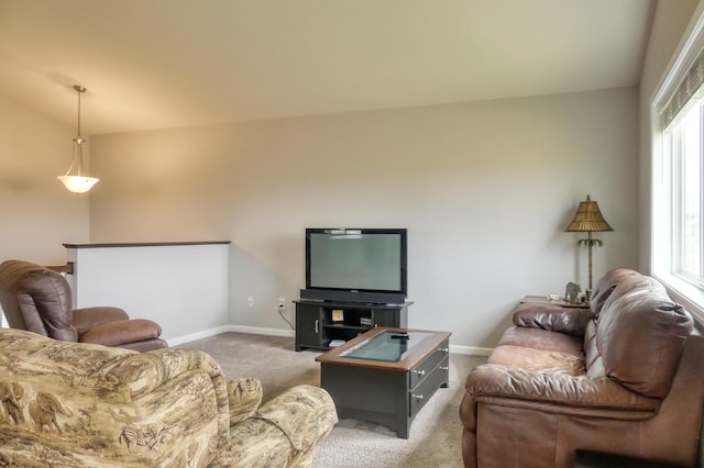 carpeted living room featuring vaulted ceiling