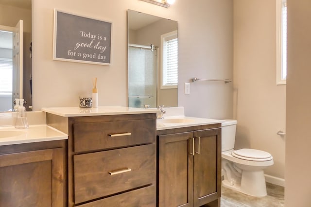 bathroom with vanity, toilet, and walk in shower