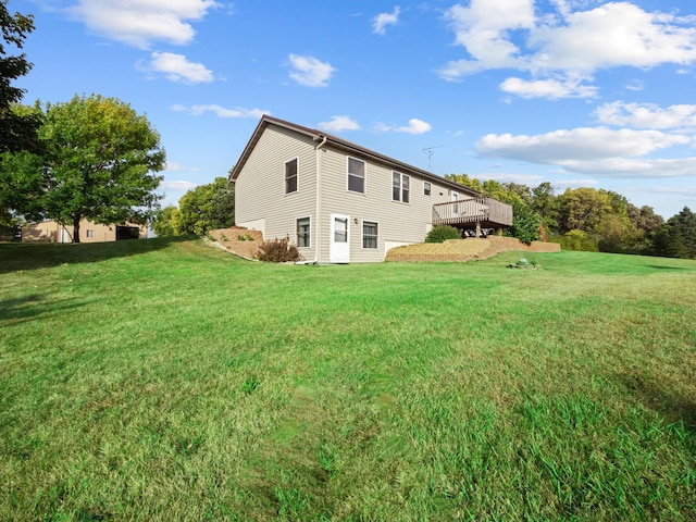 exterior space with a lawn and a wooden deck