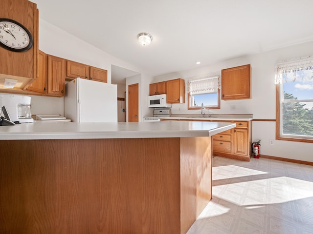 kitchen featuring sink and white appliances