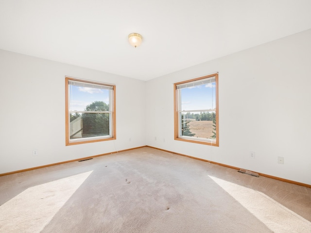 unfurnished room featuring carpet floors