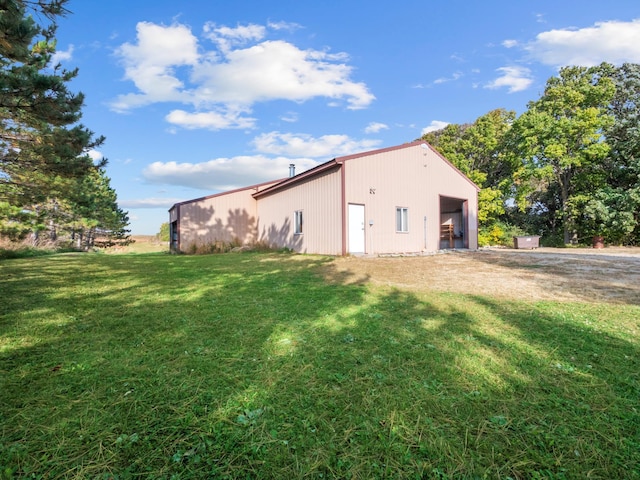 view of outdoor structure with a lawn