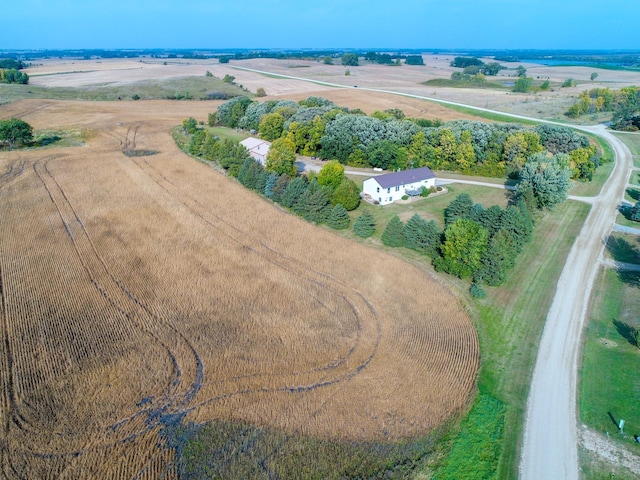 birds eye view of property with a rural view