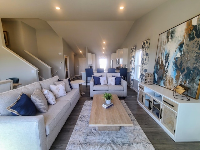 living room with vaulted ceiling and dark wood-type flooring