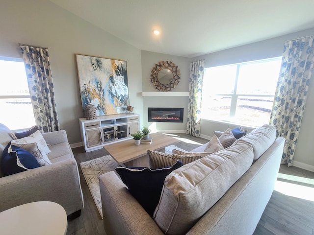 living room featuring hardwood / wood-style floors and vaulted ceiling