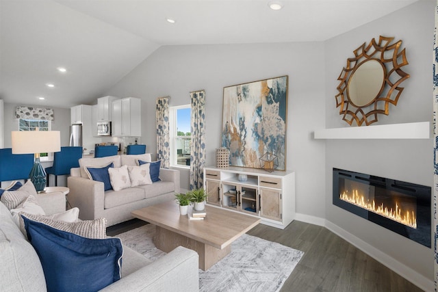 living room with dark hardwood / wood-style floors and vaulted ceiling