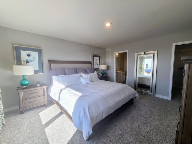 bedroom with carpet flooring and ensuite bath