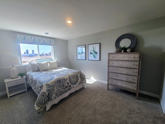 bedroom featuring dark colored carpet