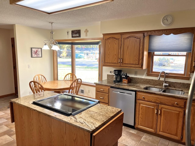 kitchen featuring a center island, sink, stainless steel dishwasher, pendant lighting, and black electric stovetop