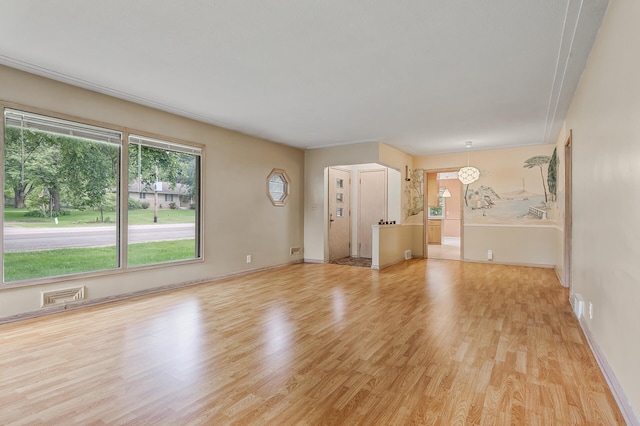 unfurnished living room with light hardwood / wood-style floors