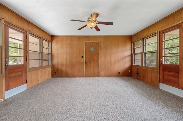 4700 Glenwood Ave, Golden Valley, MN 55422 - entryway with wooden walls, carpet floors, and ceiling fan
