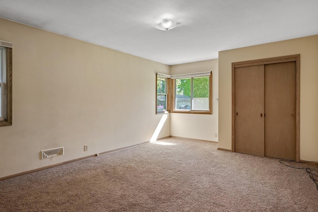4700 Glenwood Ave, Golden Valley, MN 55422 - unfurnished bedroom featuring carpet floors and a closet