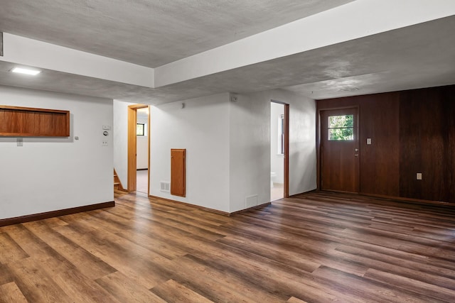 interior space with dark hardwood / wood-style flooring