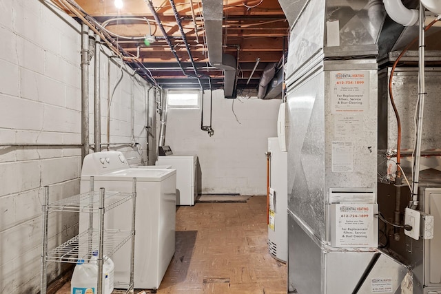 basement featuring independent washer and dryer and heating unit