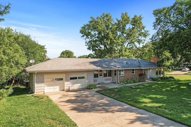 ranch-style house featuring a front lawn, covered porch, and a garage