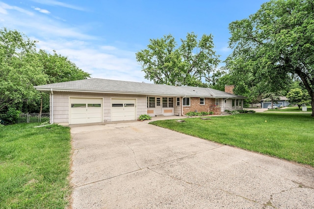 ranch-style home with a garage and a front yard