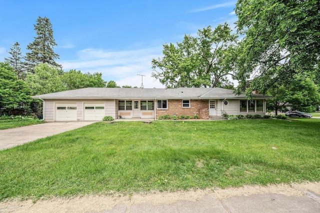 single story home with a front yard and a garage