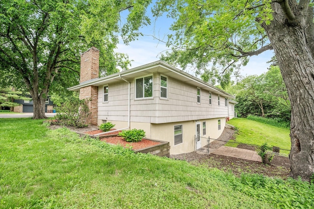 view of home's exterior featuring a yard