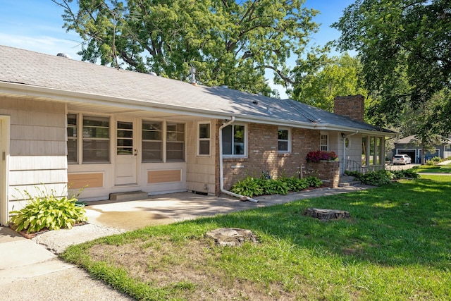 4700 Glenwood Ave, Golden Valley, MN 55422 - rear view of property with a yard and a chimney