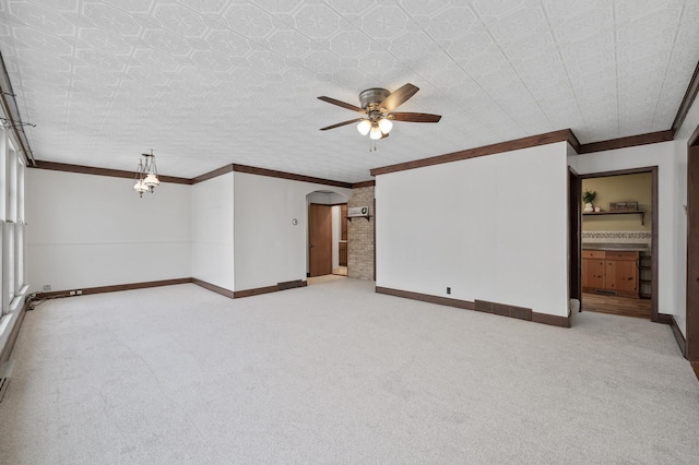 unfurnished room featuring ceiling fan, light colored carpet, and ornamental molding