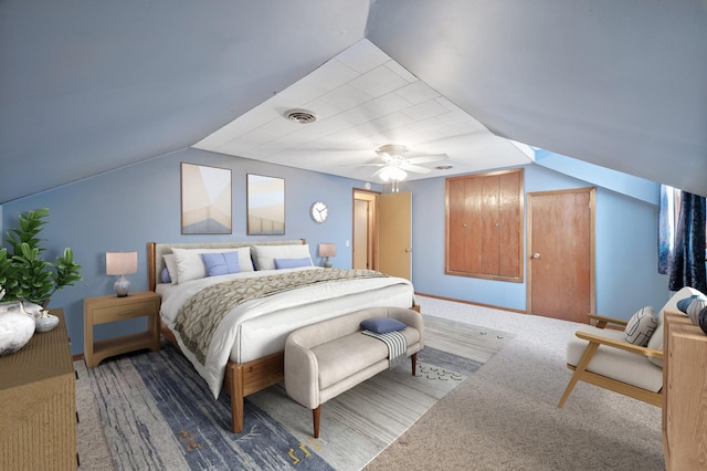 carpeted bedroom with ceiling fan and lofted ceiling