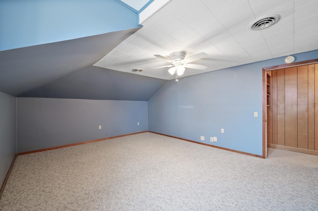 additional living space featuring carpet, ceiling fan, and lofted ceiling