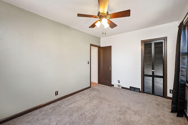 unfurnished bedroom featuring carpet flooring, ceiling fan, and a closet