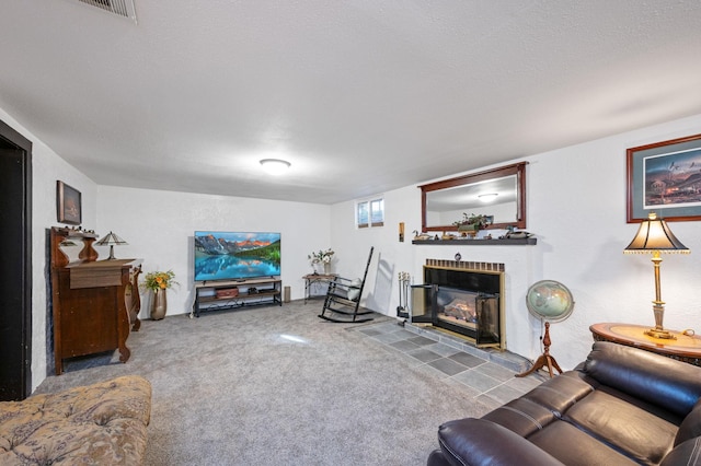 carpeted living room with a textured ceiling